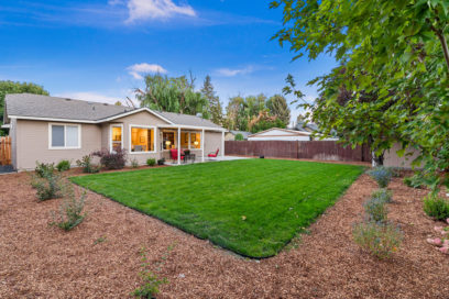 Backyard with Lawn surrounded by wood chips