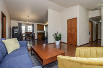 Living room with blue couch and yellow chair